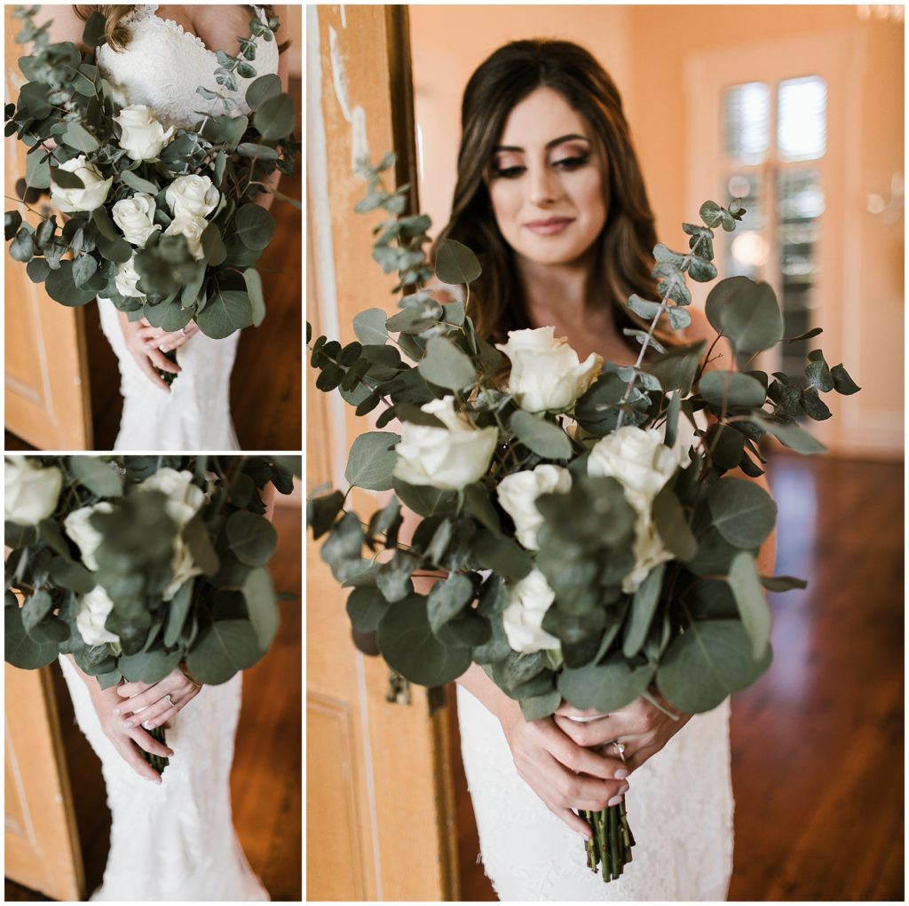 bride poses with eucalyptus and white rose wedding bouquet