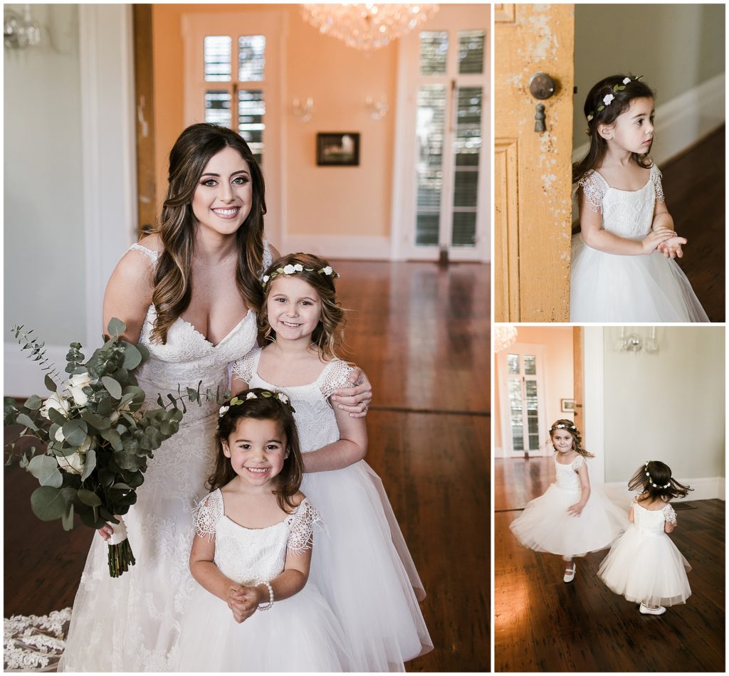 bride poses with two flower girls wearing flower crowns