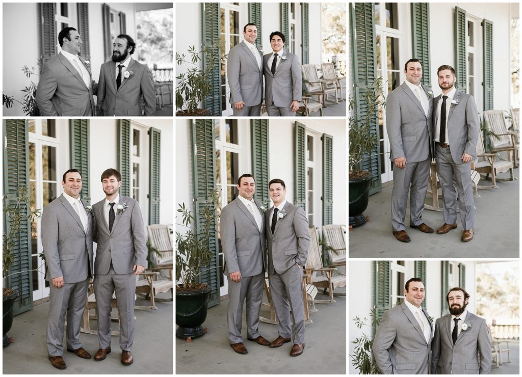 groom poses with groomsmen in gray suits