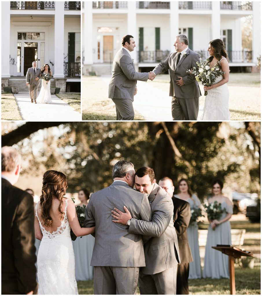 groom hugs father of the bride at the end of the wedding aisle 