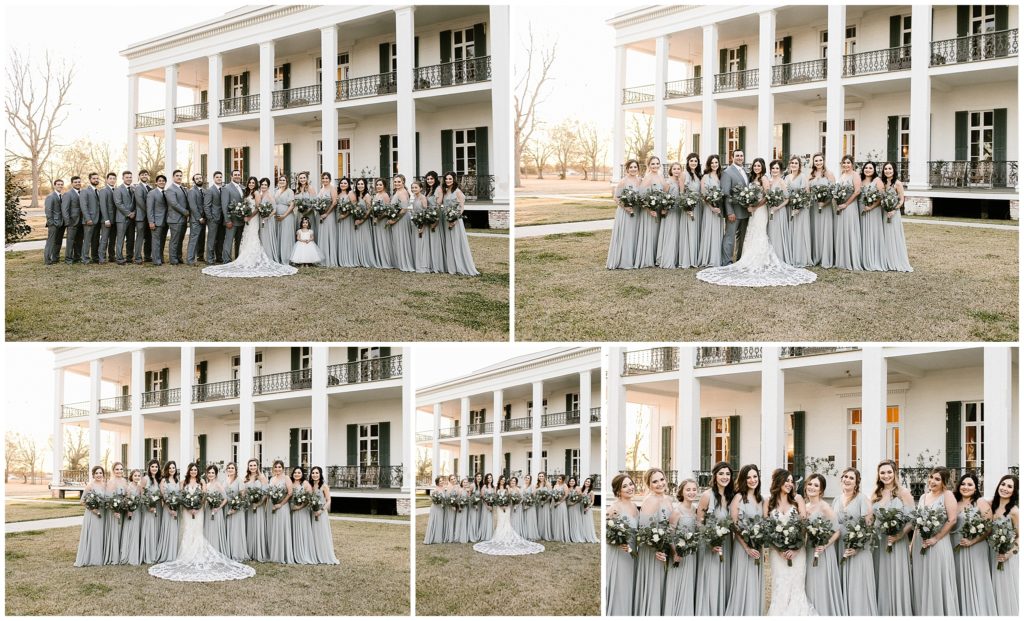 large bridal party poses in front of ducros plantation in louisiana