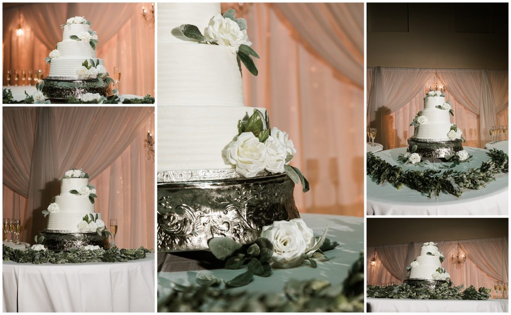 three tier wedding cake with white roses and greenery