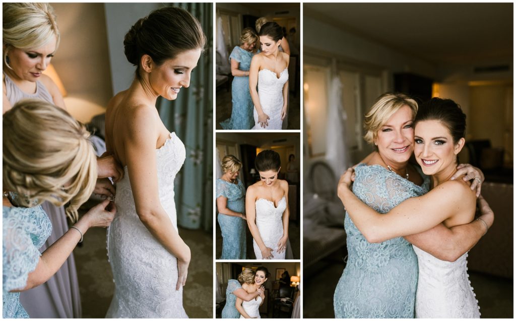mother of the bride helps bride into yvonne lafleur gown on wedding day