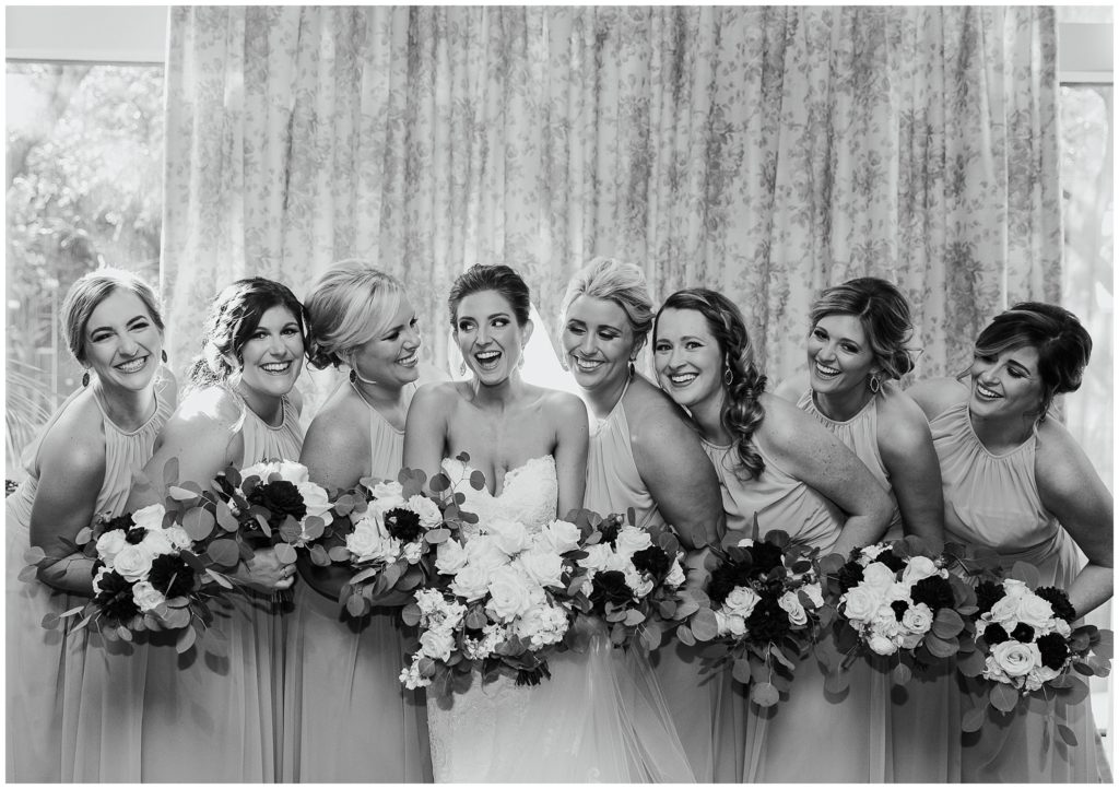 bridal party group shot in black and white at windor court hotel in new orleans