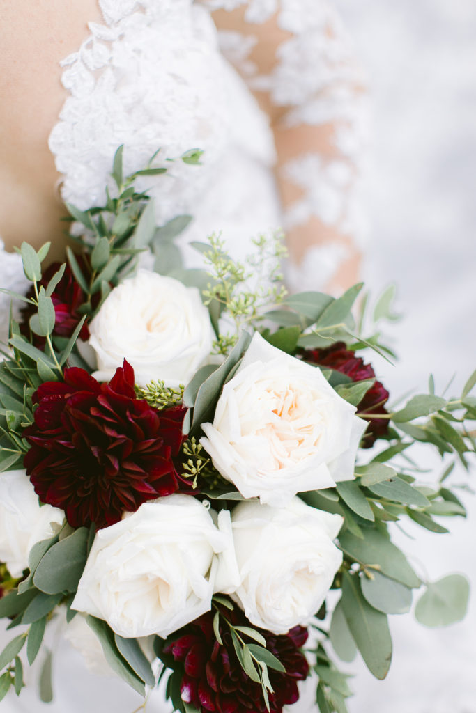 close up of burgundy and white wedding bouquet