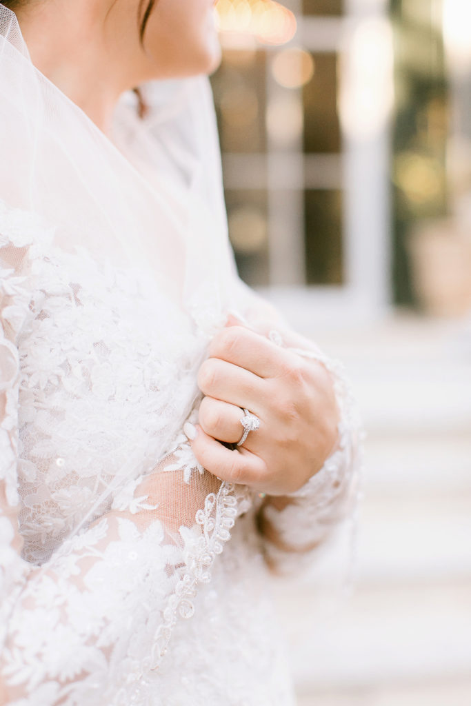 close up of bride's hands and engagement ring