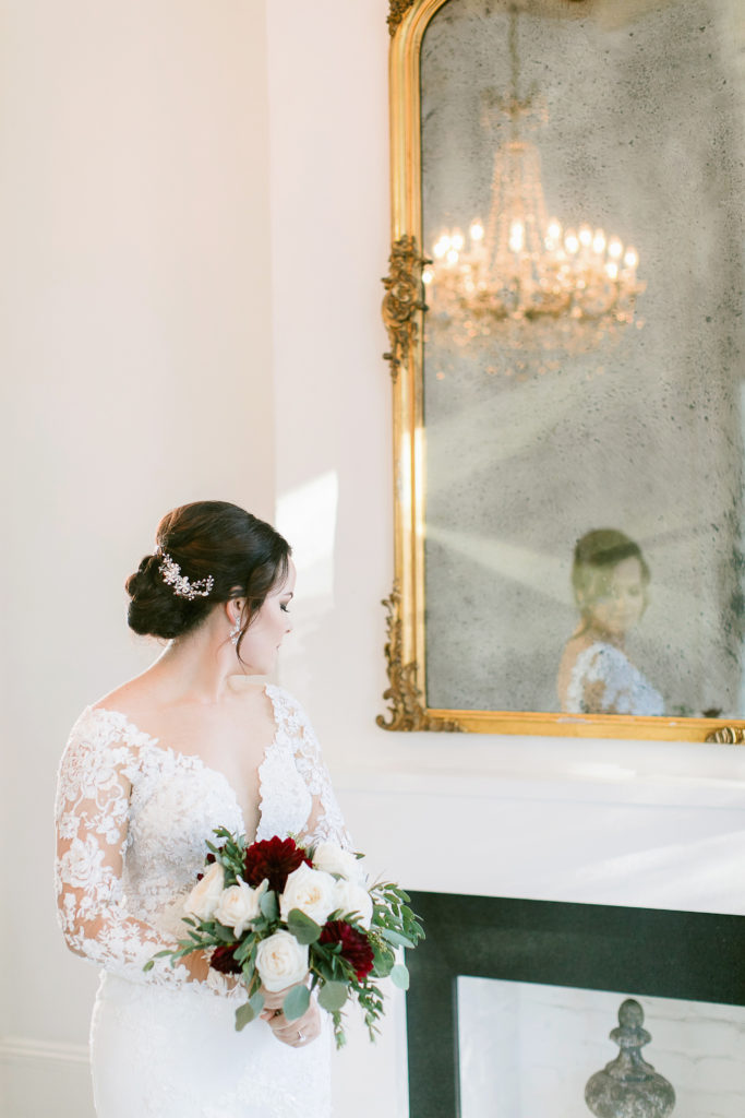 bride reflection in mirror at melrose mansion in new orleans