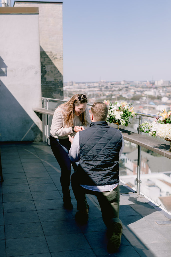 Man pops the question at a rooftop bar