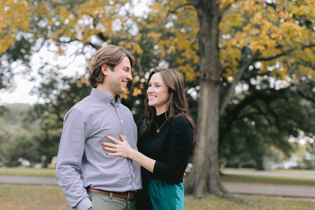 couple walking in audubon park in new orleans for lifestyle engagement session