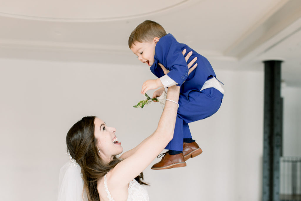 Bride playing with her son in New Orleans