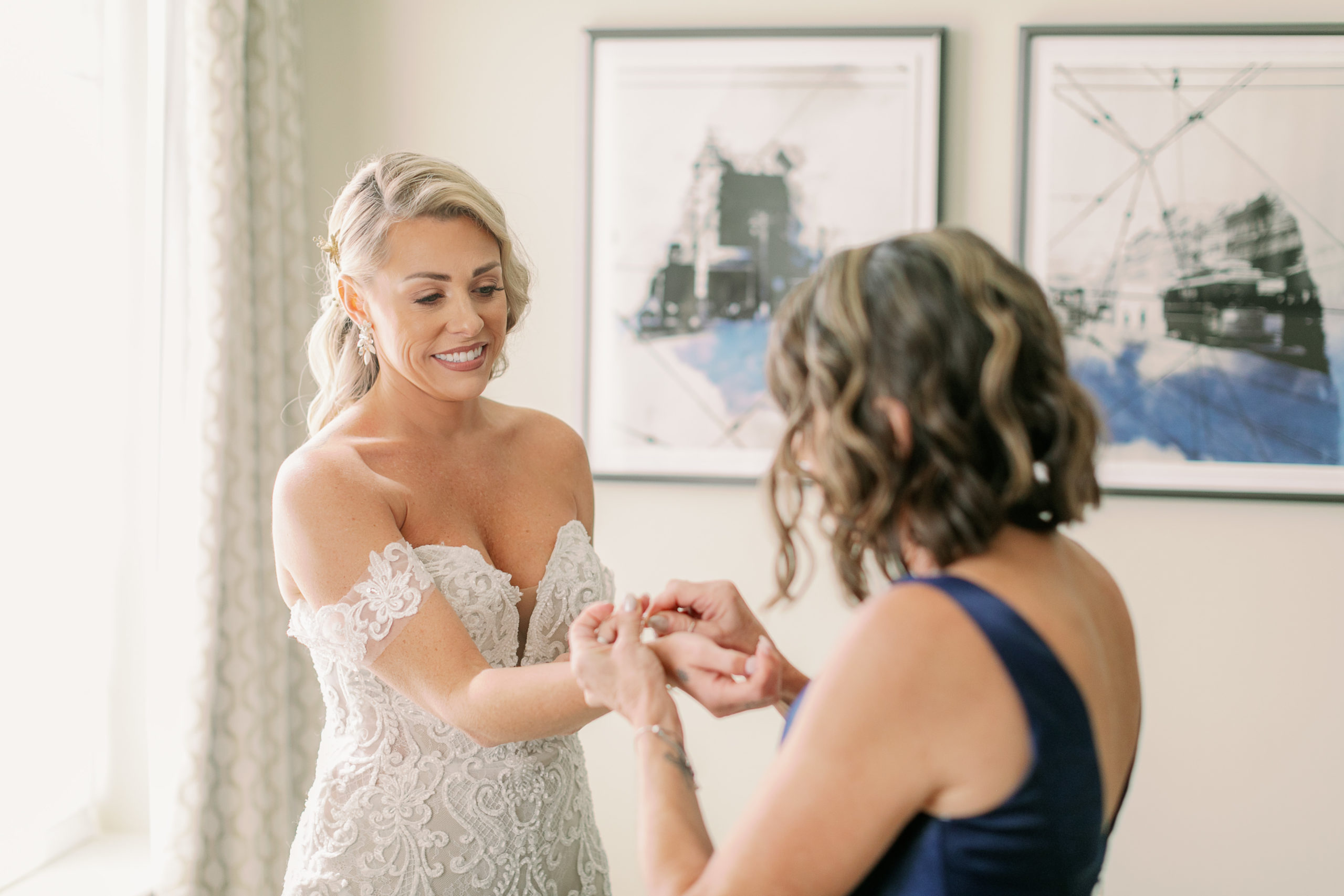 Mom helping bride with her bracelet